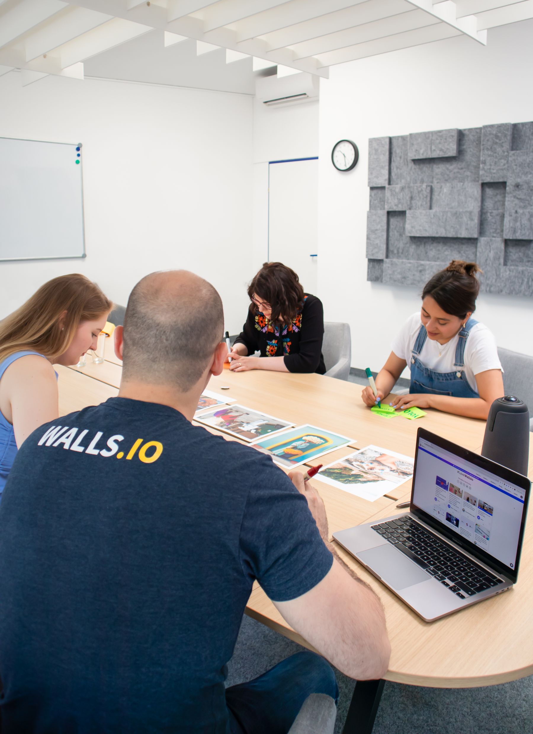 Marketing agency team collaborating with a client in a conference room