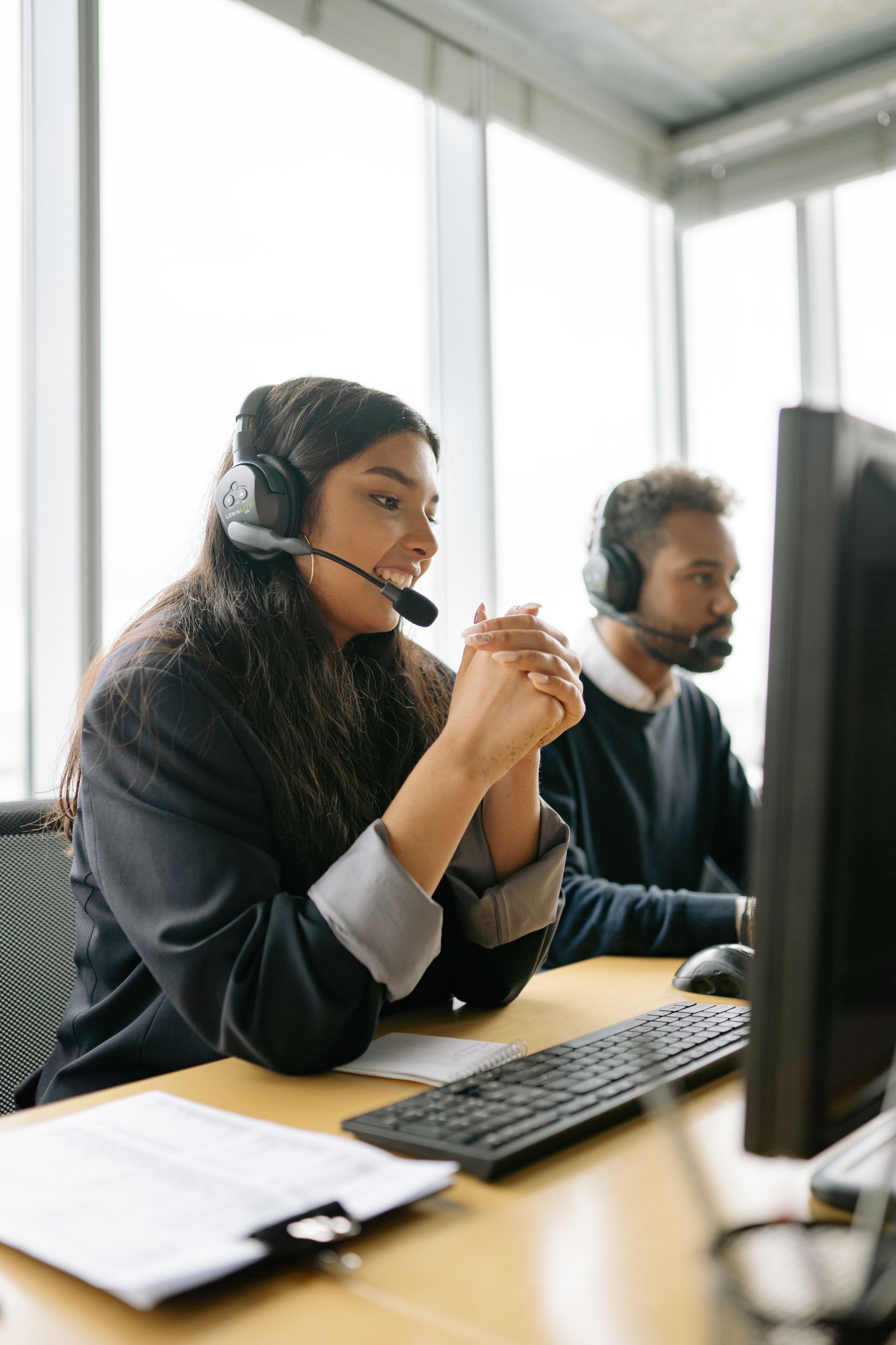 Customer service professional helping a client by phone